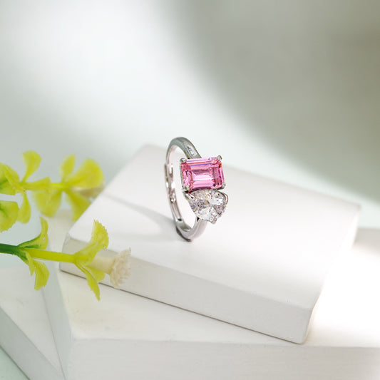 The Heart of Verona dual stone ring featuring a pink emerald cut stone and heart shaped zircon by Kohizen