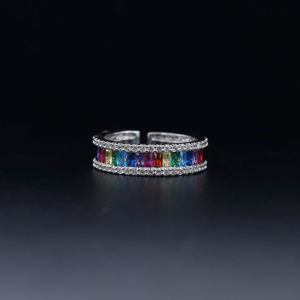 Ring with multicolored gemstones on a black background